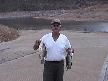 Ron Powell of Pinetop, AZ with two San Carlos Lake black crappie caught in March, 2003. 